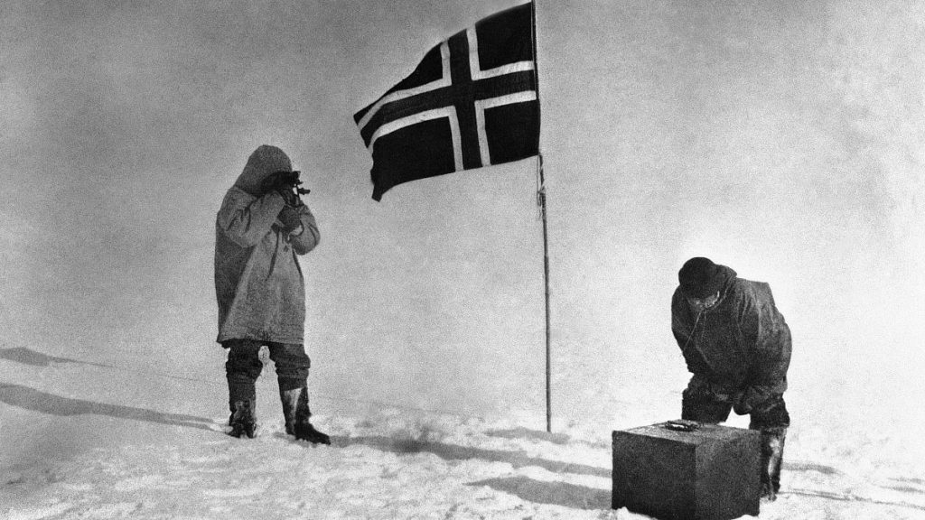 Capt. Roald Amundsen and one of his companions making observations during Arctic Exploration