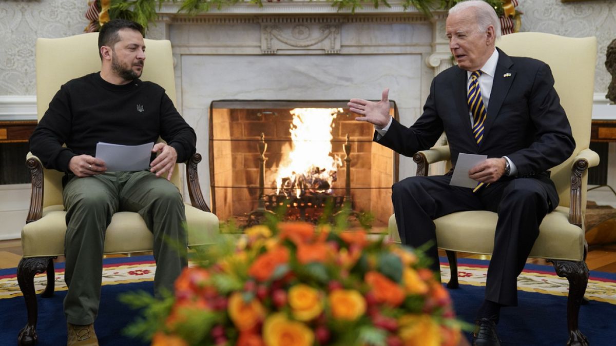 President Joe Biden reaches out to shake hands with Ukrainian President Volodymyr Zelenskyy as they meet in the Oval Office of the White House on Tuesday