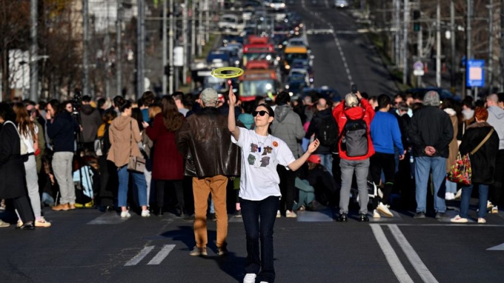 Students block one of the main streets during a protest in central Belgrade, on December 25, 2023, a week after the parliamentary and local elections in Serbia.