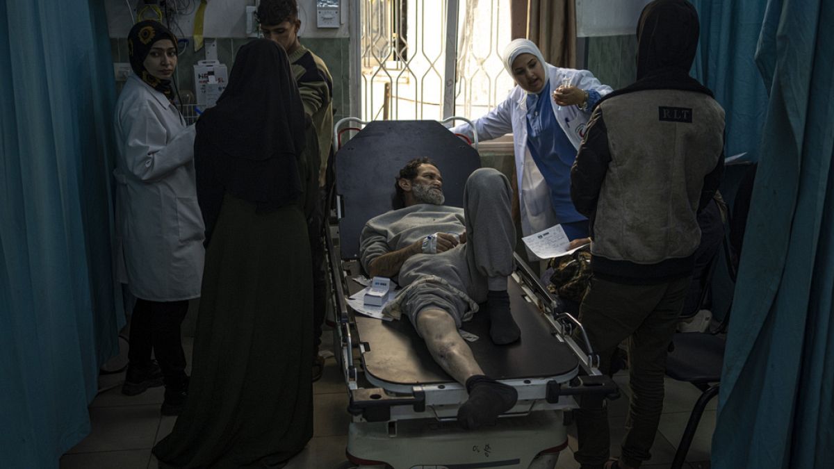 Palestinians who were arrested by the Israeli military in the north of the Gaza Strip and released through the Kerem Shalom crossing in the south wait for treatment in Rafah