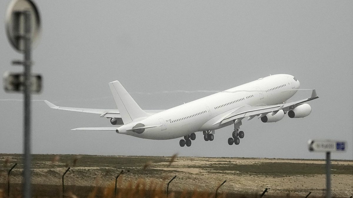 The plane grounded by police at the Vatry airport takes off Monday, Dec. 25, 2023 in Vatry, eastern France.