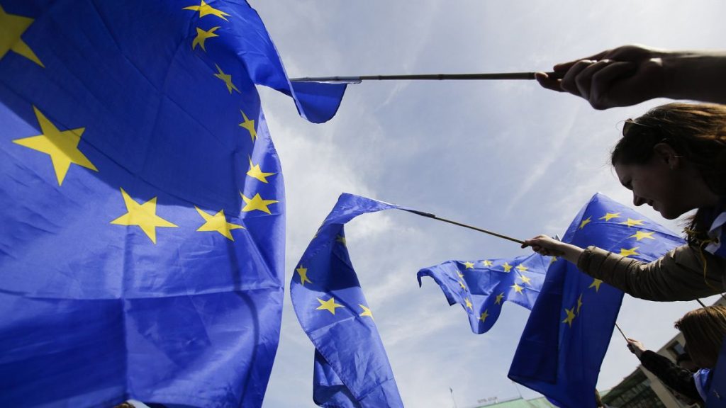 Supporters wave European flags in Berlin, Germany.