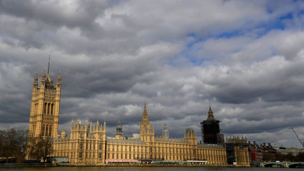 Clouds lour above the Houses of Parliament on the Embankment in London.