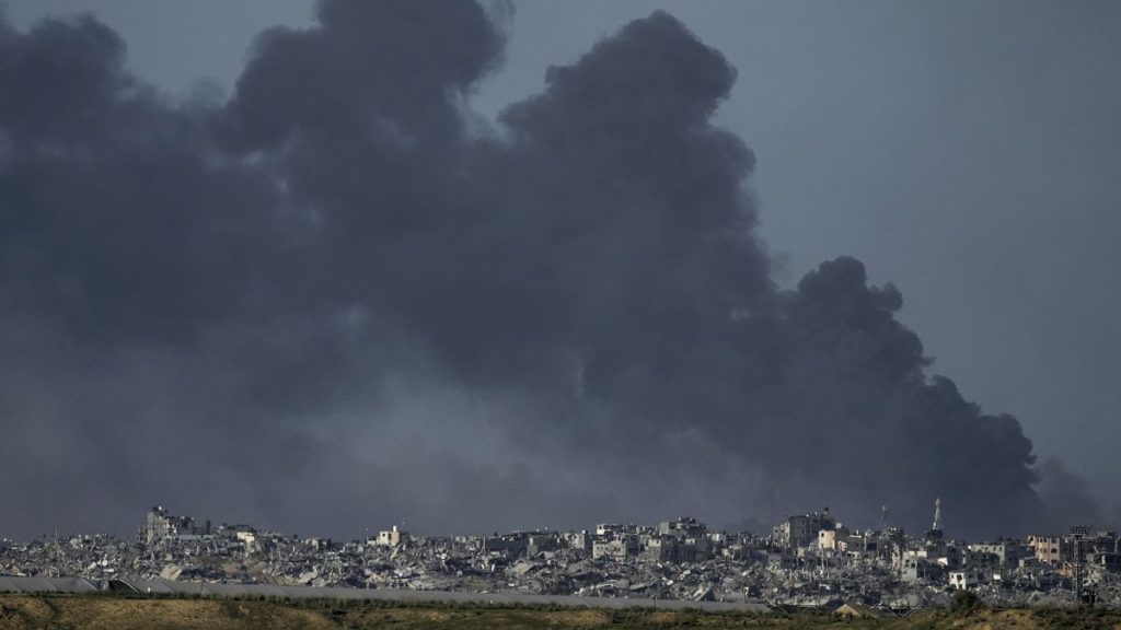 Smoke rises following an Israeli bombardment in the Gaza Strip, as seen from southern Israel, Tuesday, Dec. 26, 2023.