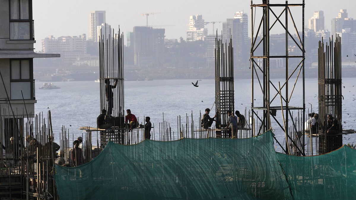 File photo of workers on a construction site in Mumbai, India