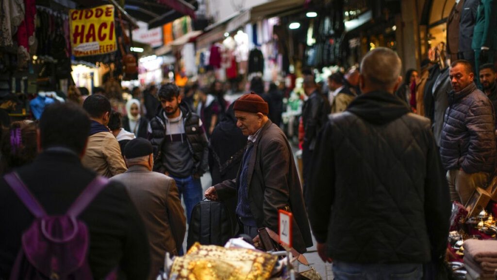 A street vendor sells hand bags in a street market in Eminonu commercial district in Istanbul, Turkey, Monday, Nov. 7, 2022.