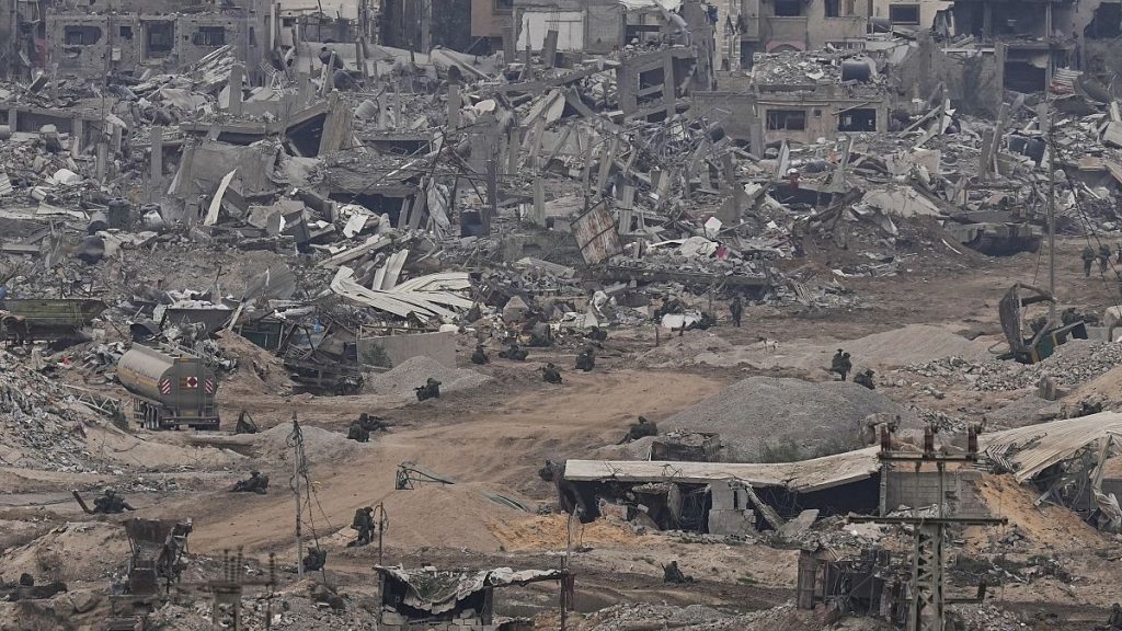 Israeli troops take positions in the Gaza Strip as seen from southern Israel, Thursday, Dec. 21, 2023