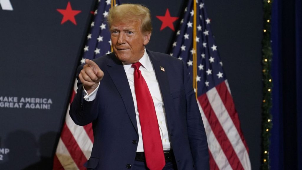 Former President Donald Trump greets supporters as he arrives at a commit to caucus rally, Tuesday, Dec. 19, 2023, in Waterloo, Iowa.