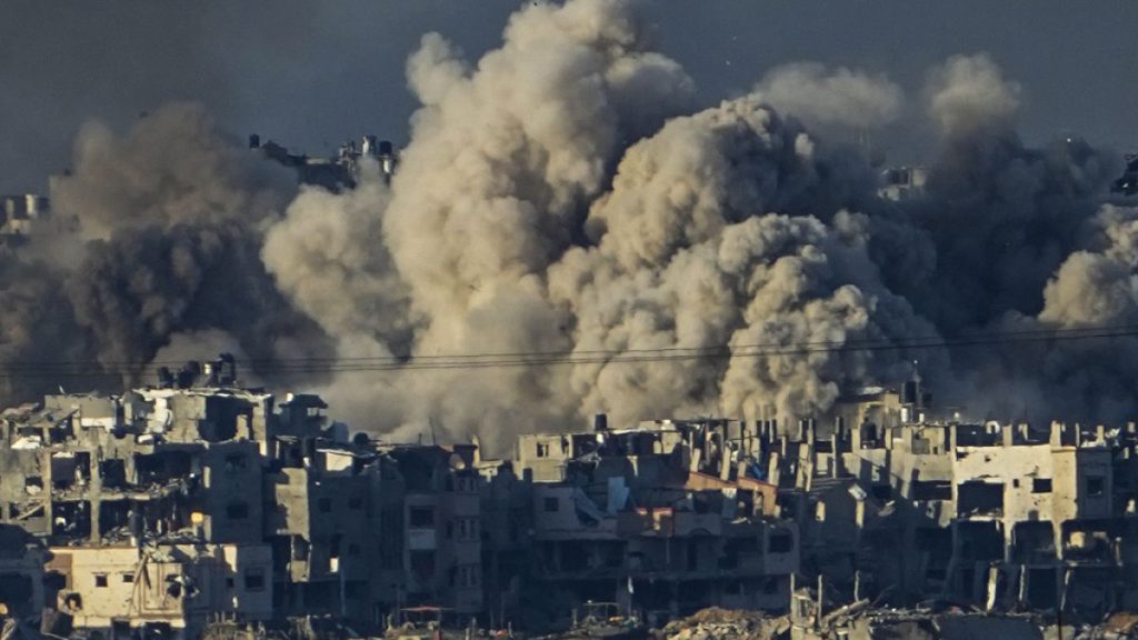 FILE - Smoke rises following an Israeli bombardment in the Gaza Strip, as seen from southern Israel, Saturday, Dec. 16, 2023.