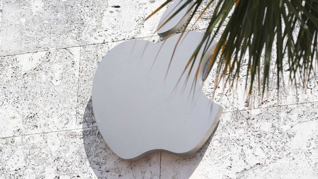 The Apple logo is displayed over one of their stores in the US.