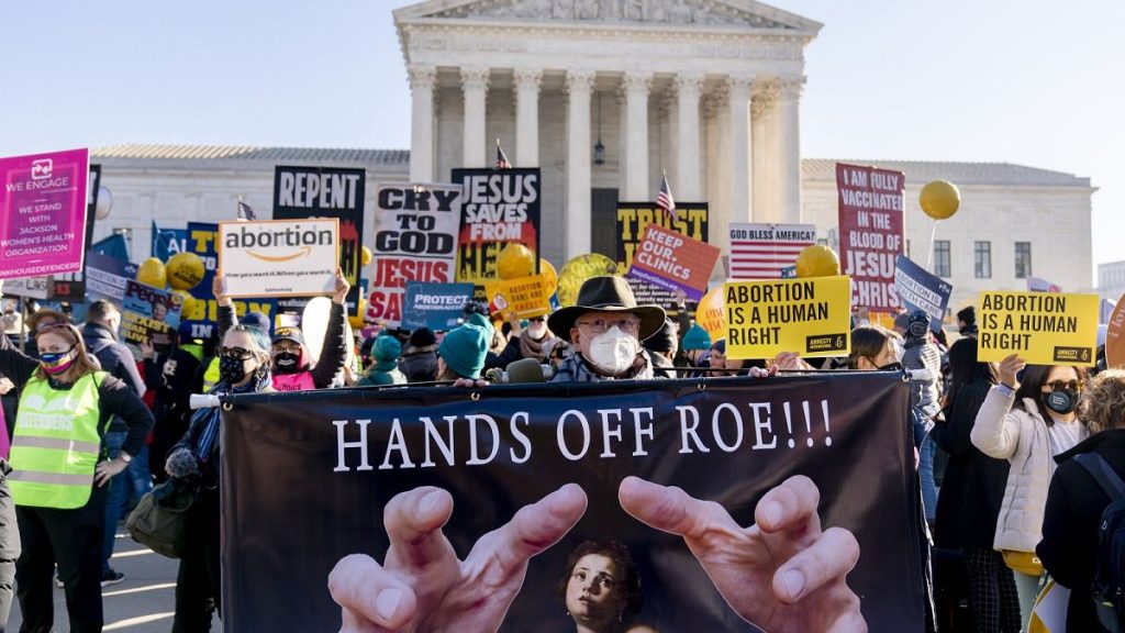 Abortion rights advocates and anti-abortion protesters demonstrate in front of the U.S. Supreme Court, Dec. 1, 2021, in Washington.