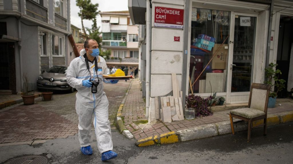 A Turkish Police forensic officer works near to Santa Maria church in Istanbul, Turkey on Sunday