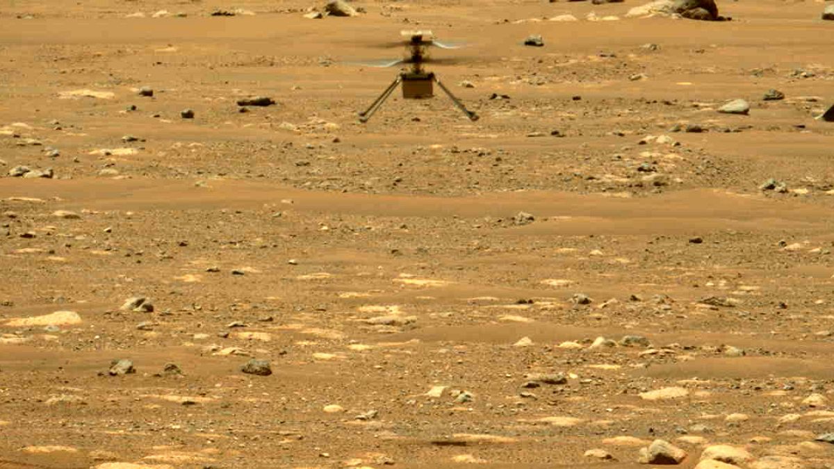 The Mars Ingenuity helicopter hovers above the surface of the planet during its second flight on April 22, 2021.