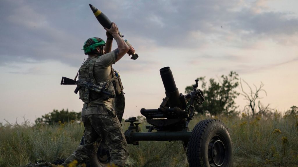 FILE - A Ukrainian serviceman of the 3rd Assault Brigade fires a 122mm mortar towards Russian positions at the front line, near Bakhmut, Ukraine, July 2023