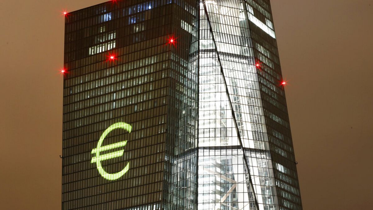 The Euro logo is projected onto the headquarters of the European Central Bank during a dress rehearsal for the