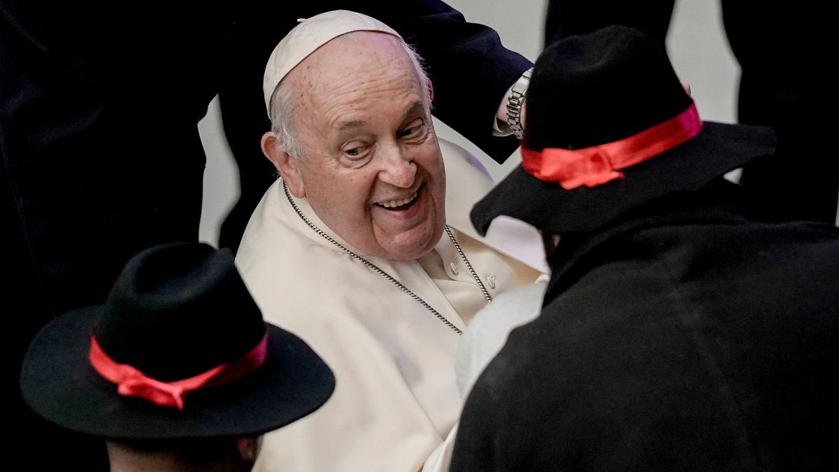 Pope Francis greets people during his weekly general audience in the Pope Paul VI hall at the Vatican, Wednesday, Jan. 3, 2024.