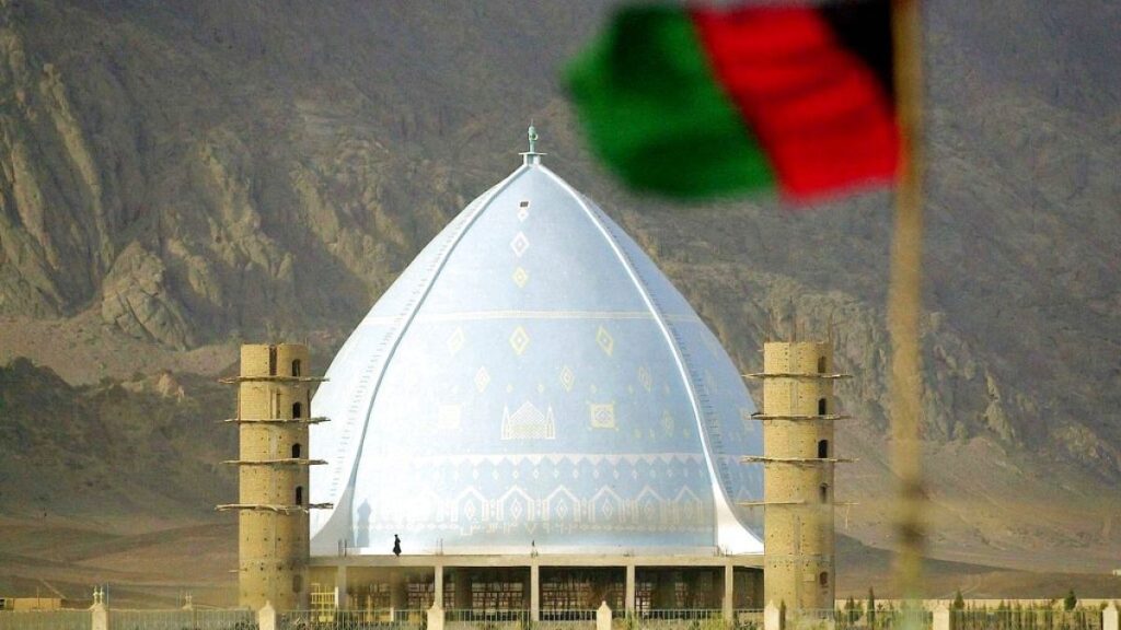 An Afghan flag is seen flying near Eidgah Mosque in Afghanistan