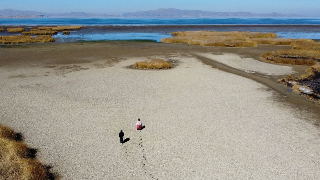 The dry cracked bed near the shore of Lake Titicaca in drought season in Huarina, Bolivia.