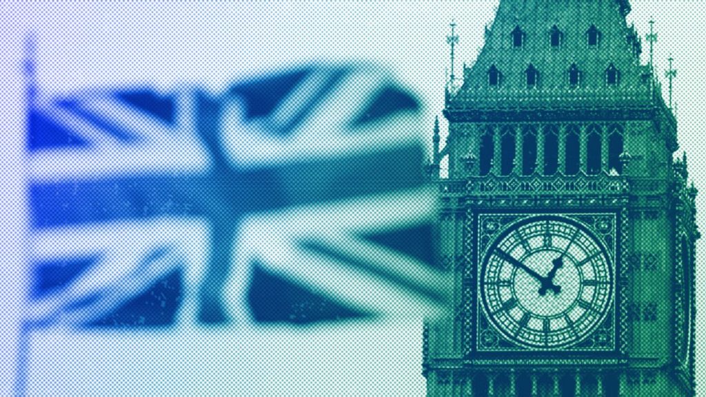 British Union flag waves in front of the Elizabeth Tower at Houses of Parliament containing the bell know as