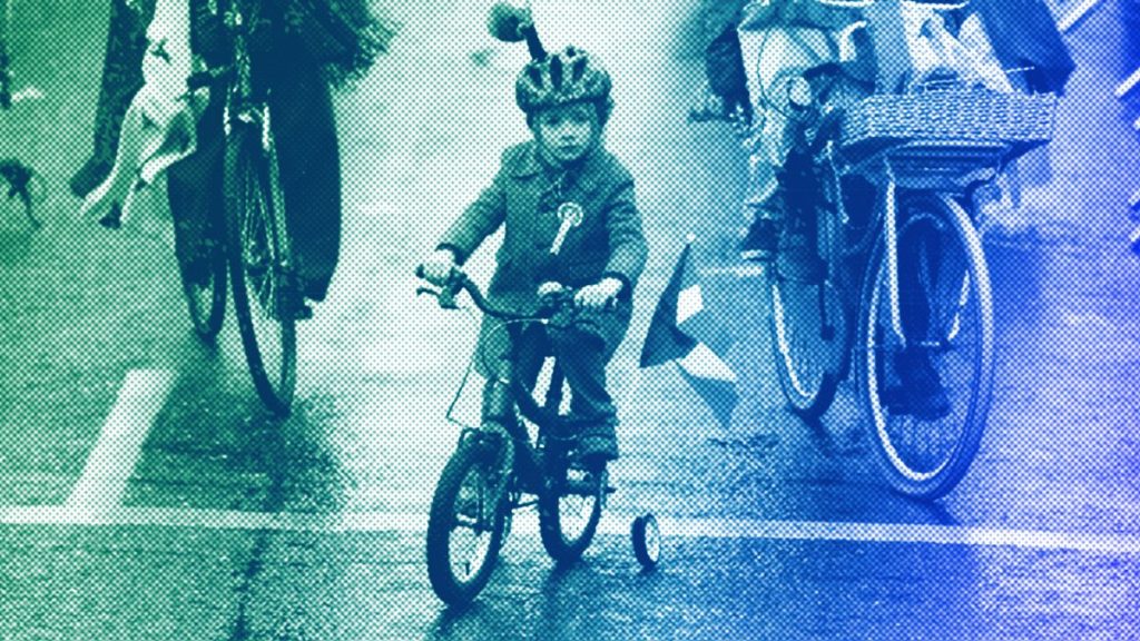 A boy joins participants as they take part in the St Patrick