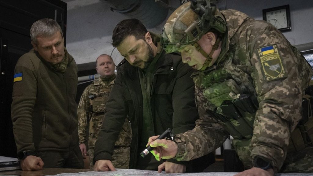 Ukrainian President Volodymyr Zelenskyy and Col.-Gen. Oleksandr Syrski look at a map during a visit to the front line city of Kupiansk, Ukraine, on Nov. 30, 2023.