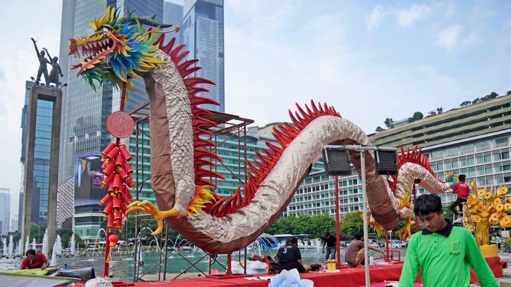 Dragon dancer performs at the opening ceremony of the annual fair at the Temple of the Earth