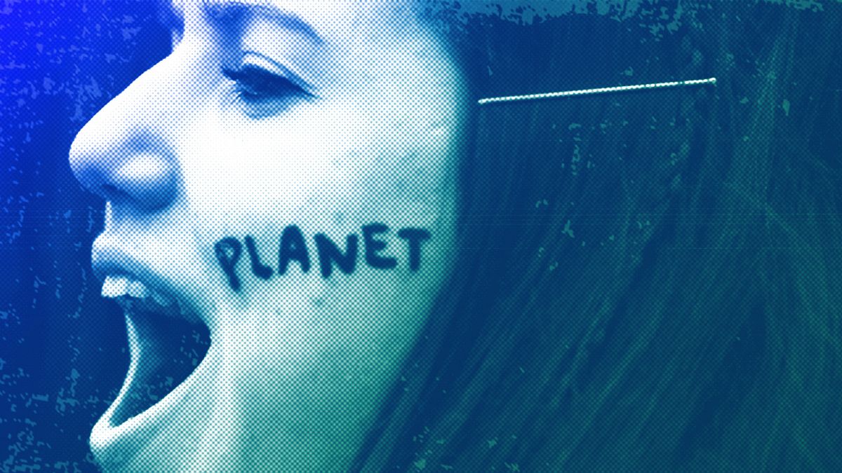 A young woman shouts slogans as she marches with thousands of others during a climate change protest in Brussels, January 2019