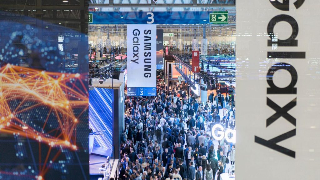 Visitors walk through the Mobile World Congress 2024 in Barcelona, Spain.