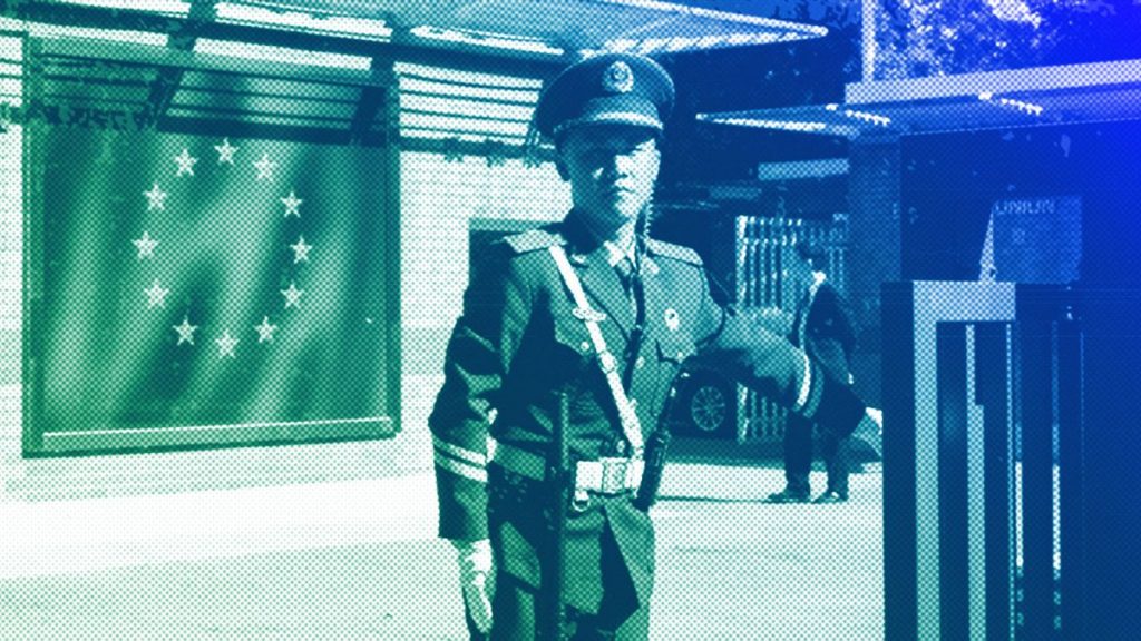 A Chinese paramilitary policeman stands guard at the entrance to the European Union Delegation to China compound in Beijing, October 2023