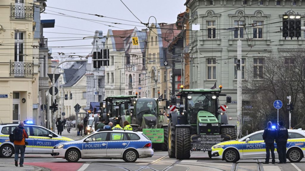 Farmers arrive with tractors for a demonstration before the start of the third conference on infrastructure development in the Lusatian and Central German coalfields.