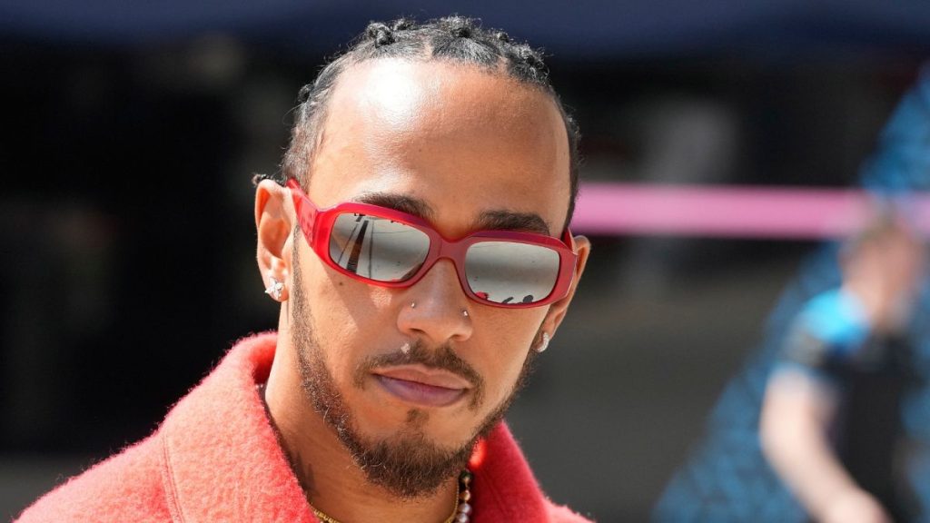 FILE - Mercedes driver Lewis Hamilton of Britain arrives at the Bahrain International Circuit in Sakhir, Bahrain, Thursday, March 2, 2023.