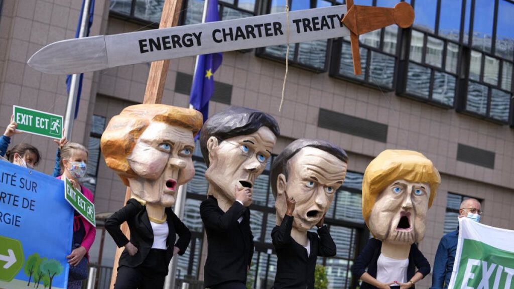 Protesters outside the EU Council headquarters in Brussels in 2021 demand withdrawal from the Energy Charter Treaty. Some now sense victory is in sight.