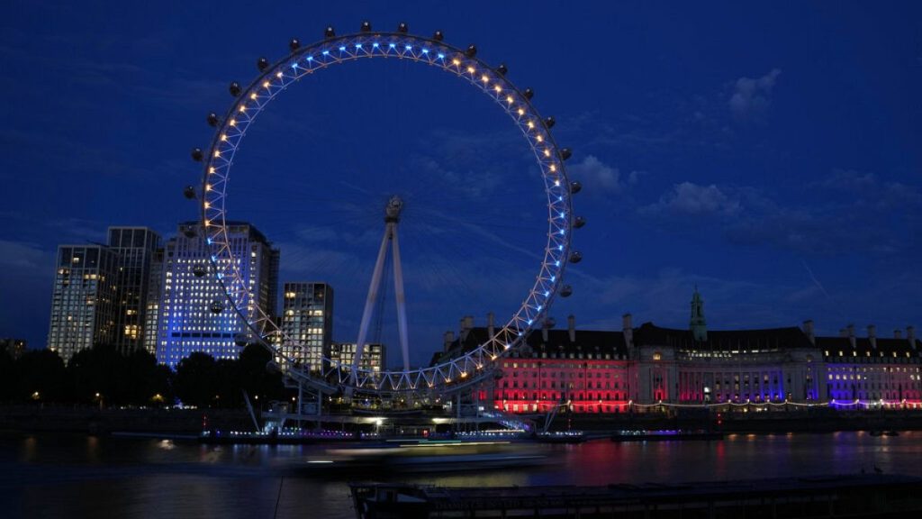 The London Eye lit up in the colors of the Ukraine to mark their Independence Day in London, Wednesday, Aug. 24, 2022.