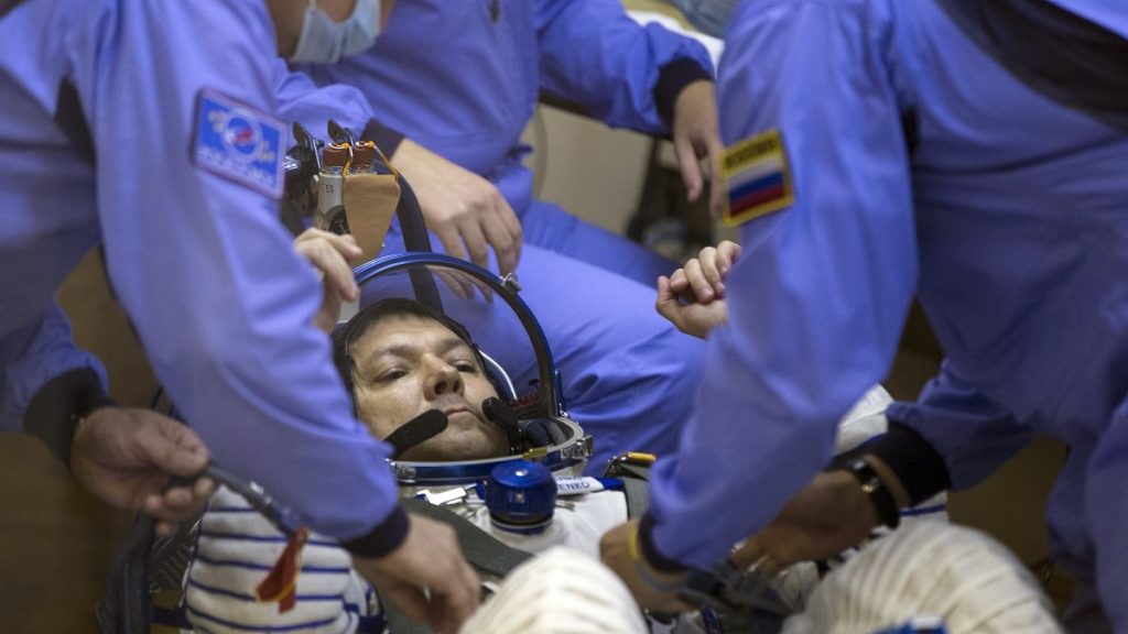 Russian Space Agency experts test a space suit of Russian cosmonaut Oleg Kononenko, before a launch on the Soyuz rocket.