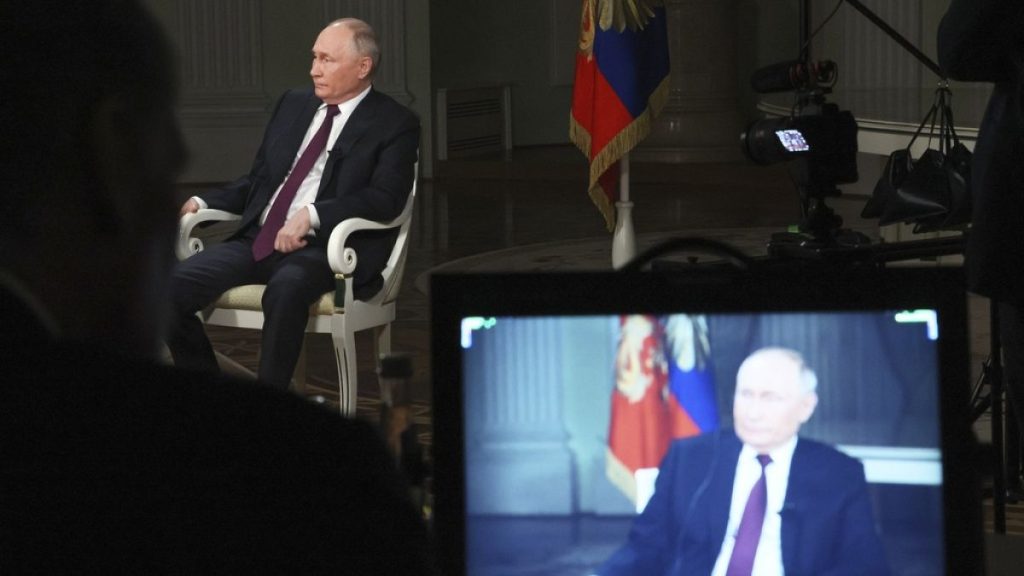 Russian President Vladimir Putin attends an interview with former Fox News host Tucker Carlson at the Kremlin in Moscow, Russia, Tuesday, Feb. 6, 2024.