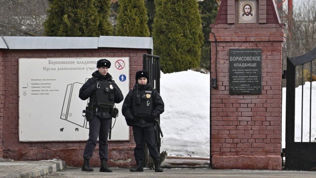 Officers stand guard in front of cemetery where Alexei Navalny will be laid to rest