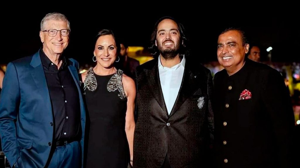 Billionaire industrialist Mukesh Ambani, Anant Ambani, Paula Hurd, and Bill Gates posing for a photograph at a pre-wedding bash of Mukesh Ambani