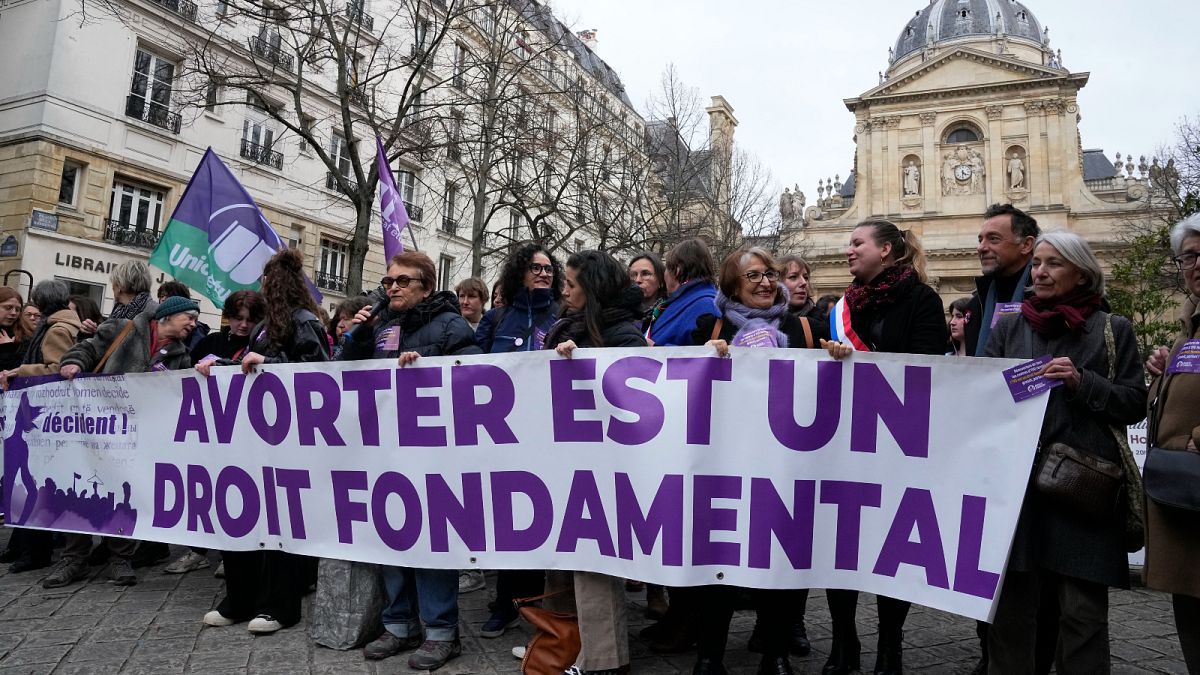 Pro-abortion rights activists attend a rally outside La Sorbonne university in Paris.