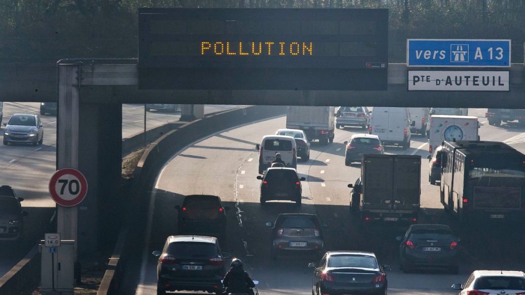 Vehicles drive on Paris ring during a pollution spike.