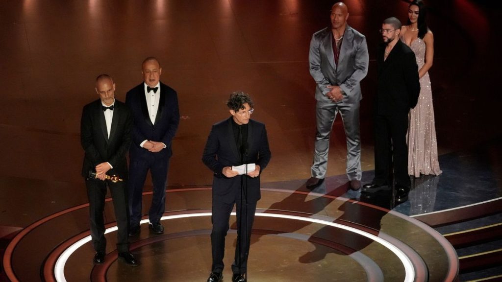 James Wilson, from left, Leonard Blavatnik, and Jonathan Glazer accept the award for "The Zone of Interest