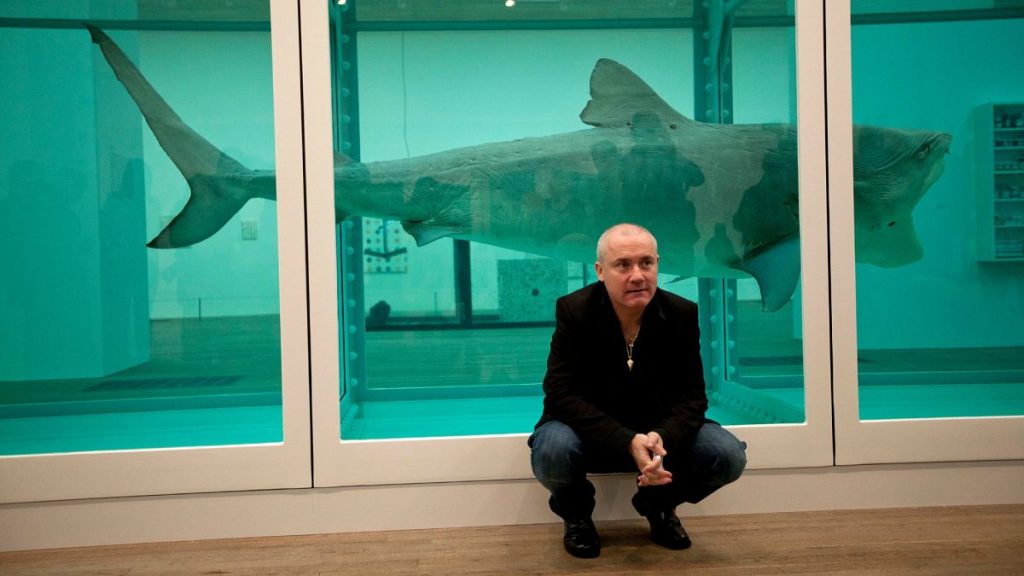 Damien Hirst beside the 1991 piece