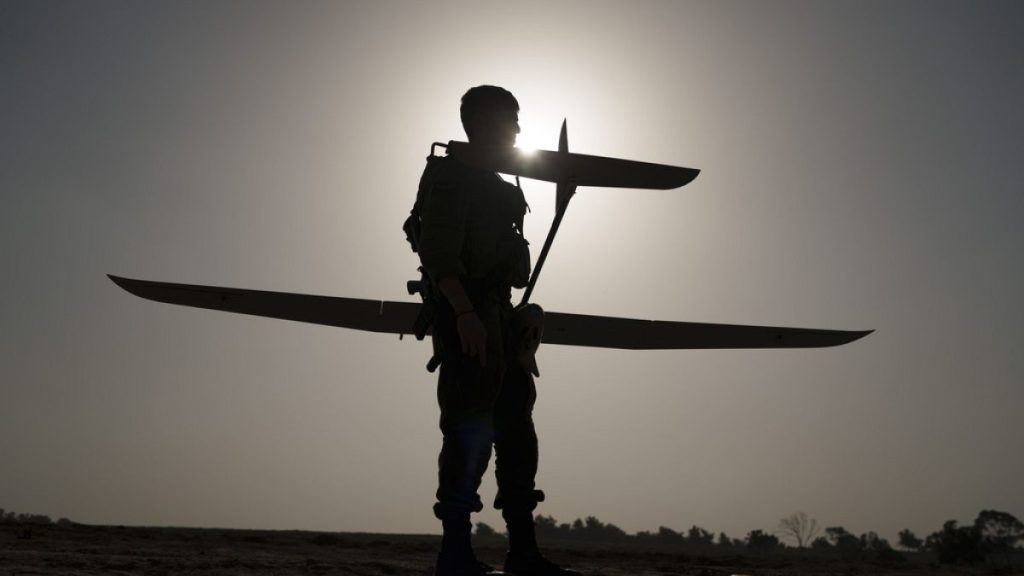 An Israeli soldier prepares a drone to be launched near the Israeli-Gaza border, southern Israel, Tuesday, Jan. 9, 2024.