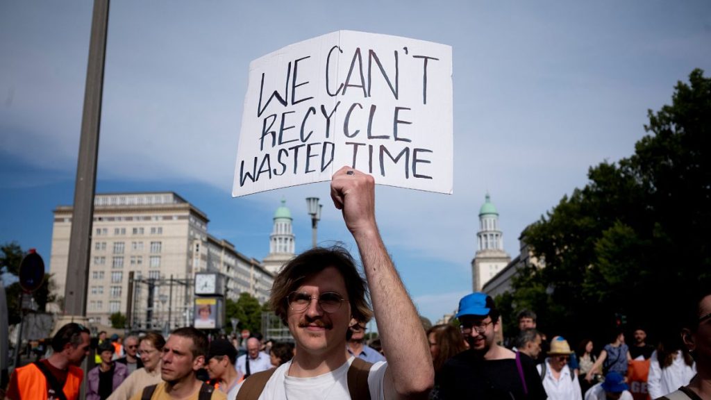 A man attends a climate protest in Berlin, Germany.