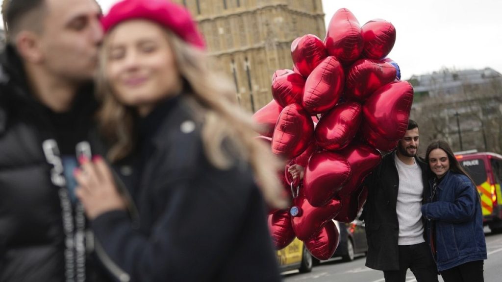 Couples pose for a photograph during the Valentine