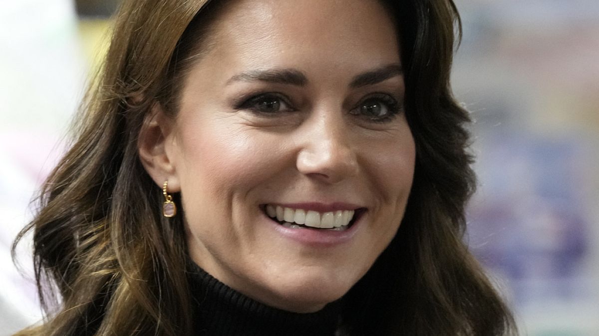 Kate, Princess of Wales smiles as she speaks to a woman during her visit to Sebby