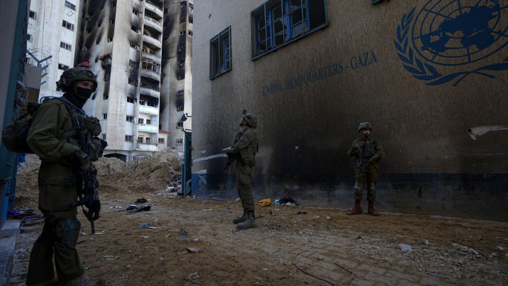 Israeli soldiers take position as they enter the UNRWA headquarters in Gaza, Thursday, Feb. 8, 2024.