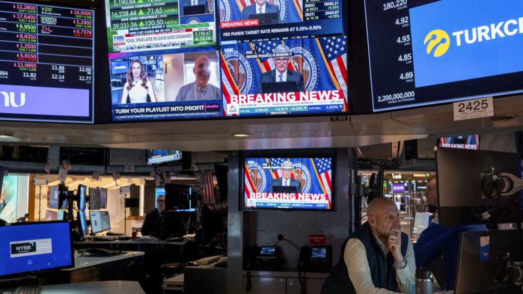 Traders work on the floor of the New York Stock Exchange Wednesday, March 20, 2024, during Powell speech