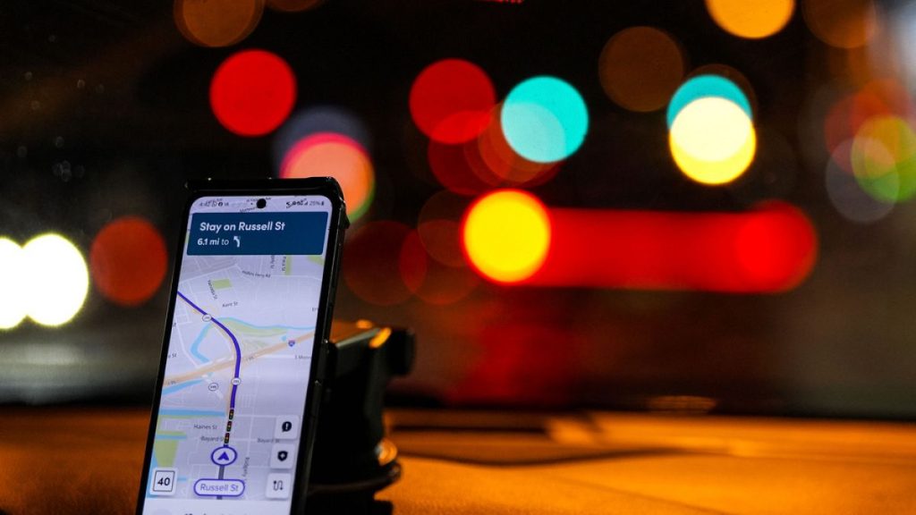 A Lyft driver takes a customer to the airport, Monday, Jan. 29, 2024, in Baltimore. (AP Photo/Mike Stewart)