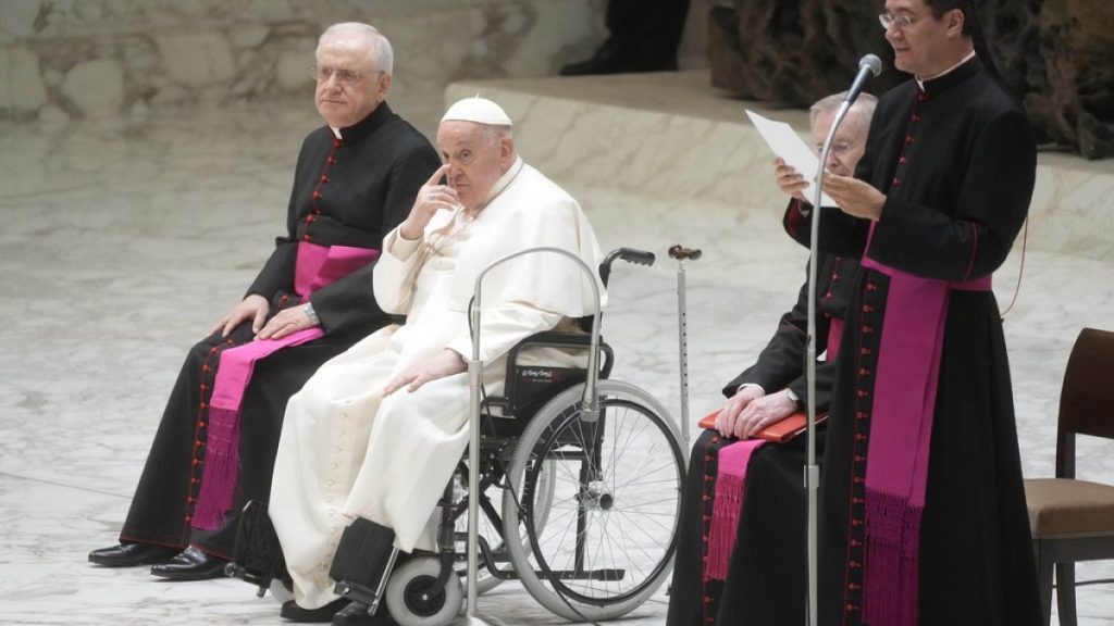 Pope Francis arrives in the Paul VI Hall to meet with the staff of the Vatican Pediatric Hospital Bambin Gesu at the Vatican, Saturday, March 15, 2024.