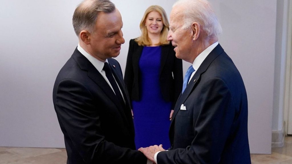 President Joe Biden, right, is greeted by Polish President Andrzej Duda, Feb. 22, 2023, at the Presidential Palace in Warsaw.